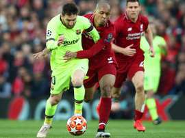 Fabinho attempting to stop Lionel Messi. GOAL