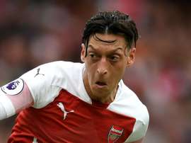 Ozil has had a tough summer. GOAL