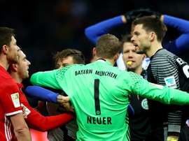 Manuel Neuer separating Rune Jarstein from Philippe Lahm. Goal
