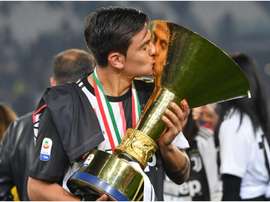 Paulo Dybala with the Serie A trophy. GOAL