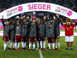 Philipp Lahm lifts the Telekom Cup for Bayern Munich. Goal