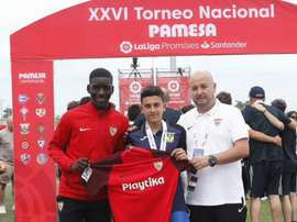 Reyes' son was presented with a Sevilla shirt at a football tournament. GOAL