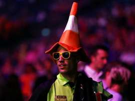 Van Persie wears traffic cone at Premier League Darts