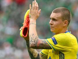 Victor Lindelof celebrating a goal with a shoe in his hand. Goal