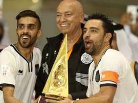 Xavi wins first trophy with Al Sadd. AFP