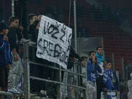 Greece fans hold up offensive banners. Twitter/BiHFootball