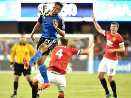 JJ Koval (top) of the San Jose Earthquakes jumps for the ball while fending off Phil Jones of Manchester United during an International Champions Cup match at Avaya Stadium in San Jose, California on July 21, 2015