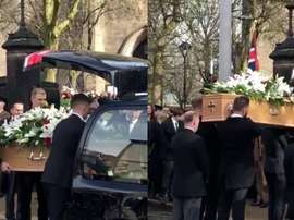 The coffin is carried into the Stoke-on Trent church.