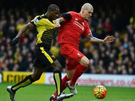 Le défenseur de Liverpool Martin Skrtel à la lutte avec l'attaquant de Watford Odion Ighalo. AFP