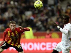 Lens French midfielder Benjamin Bourigeaud (L) challenges Lille Senegalese midfielder Idrissa Gueye during the French L1 football match between Lens and Lille at the Stade de France in Saint-Denis, north of Paris, on December 7, 2014