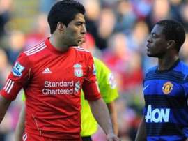 Suarez was banned for racially abusing Evra. AFP