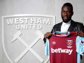Masuaku poses for photos with the West Ham shirt. WHUFC