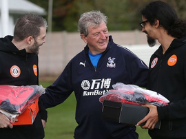 Roy Hodgson shares kind word with members of the homeless World Cup team. CPFC/TWITTER