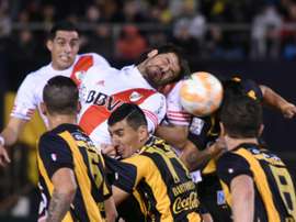 River Plate Rodrigo Mora (C top) heads the ball in the middle of a scramble with Guarani during their Libertadores Cup semi-final second leg match at the Defensores del Chaco stadium in Asuncion, on July 21, 2015