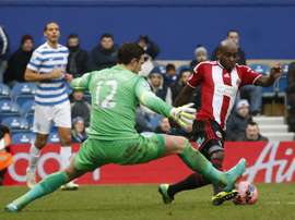 Sheffield United Jamal Campbell-Ryce (R) rounds Queens Park Rangers English goalkeeper Alex McCarthy (C) during the English FA Cup third round football match at Loftus Road Stadium in London, on January 4, 2015