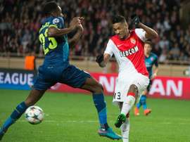 Wallace (right) kicks the ball in front of Danny Welbeck during the UEFA Champions League match at Louis II stadium in Monaco on March 17, 2015