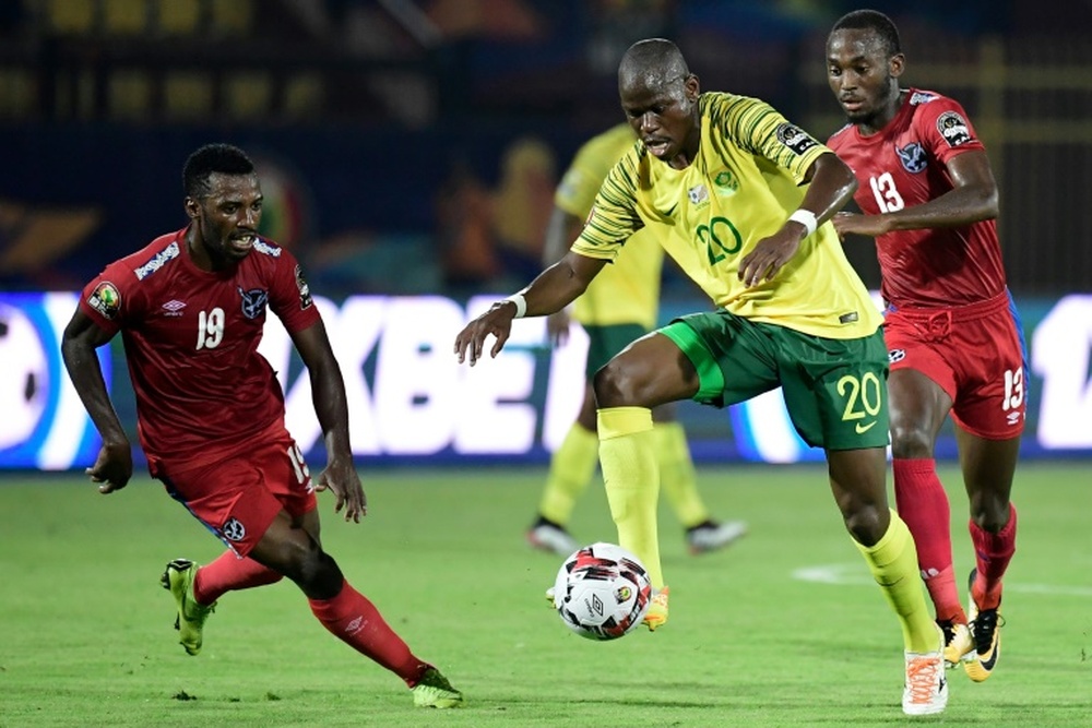 Hlompho Kekana (C) saw his spot kick saved as Mamelodi Sundowns were beaten. AFP