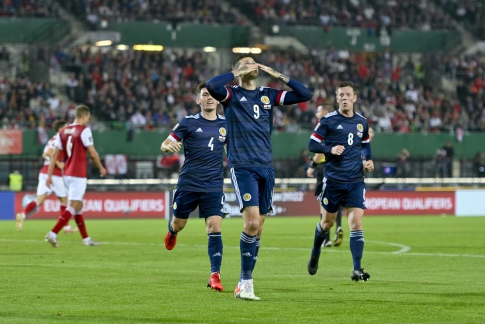 Lyndon Dykes penalty was the difference. AFP