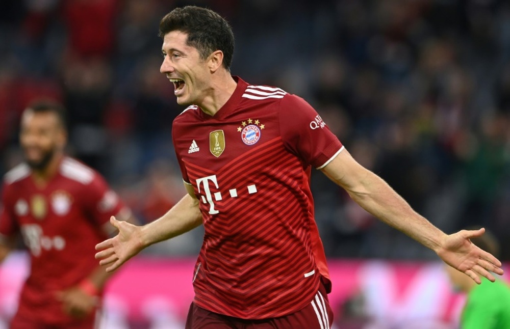 Robert Lewandowski scored three times in a 5-0 win over Hertha. AFP