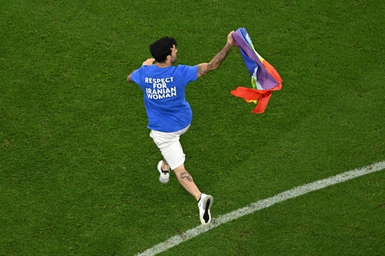 Man with rainbow flag invades pitch during World Cup clash